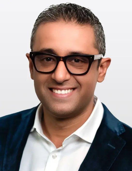 Man in a blazer and shirt.